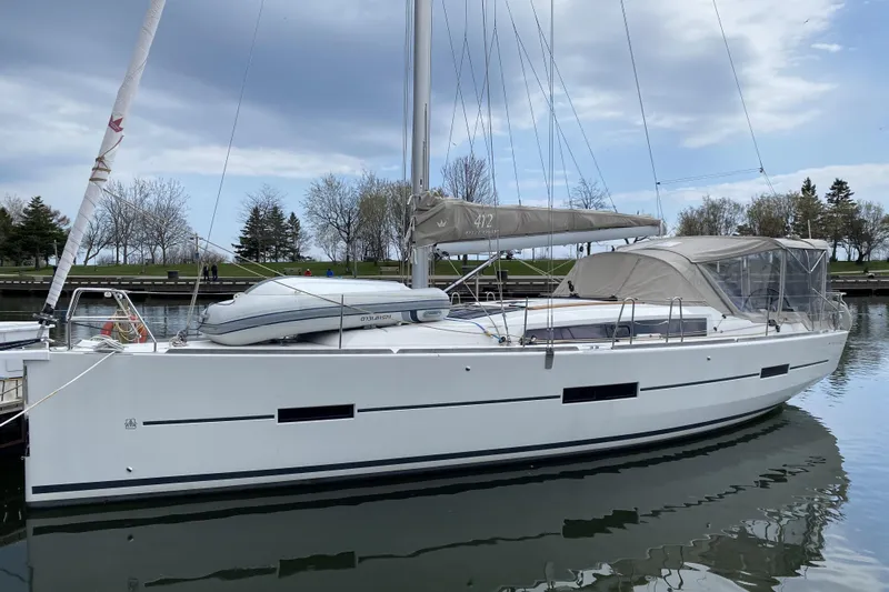 Yacht Photos Pics 2019 Dufour Grand Large 412 Grand Prix sailboat docked in calm waters.