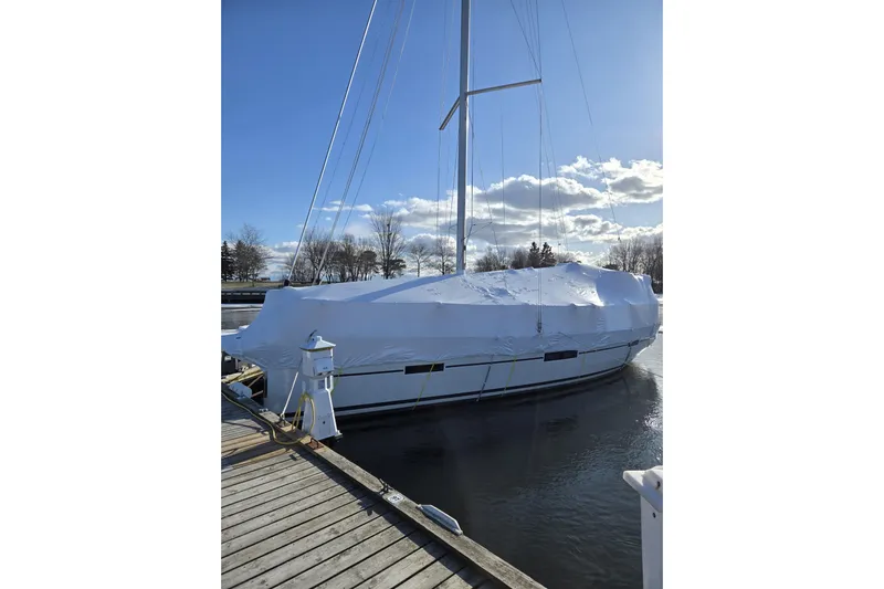  Yacht Photos Pics 2019 Dufour Grand Large 412 Grand Prix sailboat covered at dock in winter.