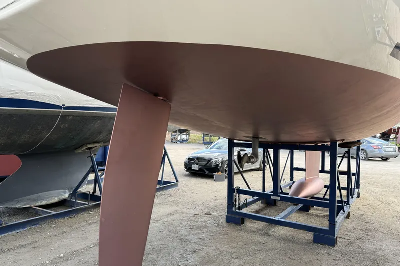  Yacht Photos Pics 2019 Dufour Grand Large 412 Grand Prix sailboat on a stand, showing keel and hull.