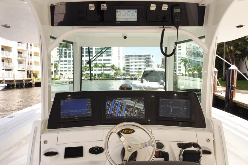  Yacht Photos Pics Helm of 2020 HCB 42 Siesta boat with advanced navigation displays and controls.