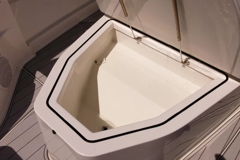  Yacht Photos Pics Open storage compartment on 2020 HCB 42 Siesta boat, showcasing spacious interior design.