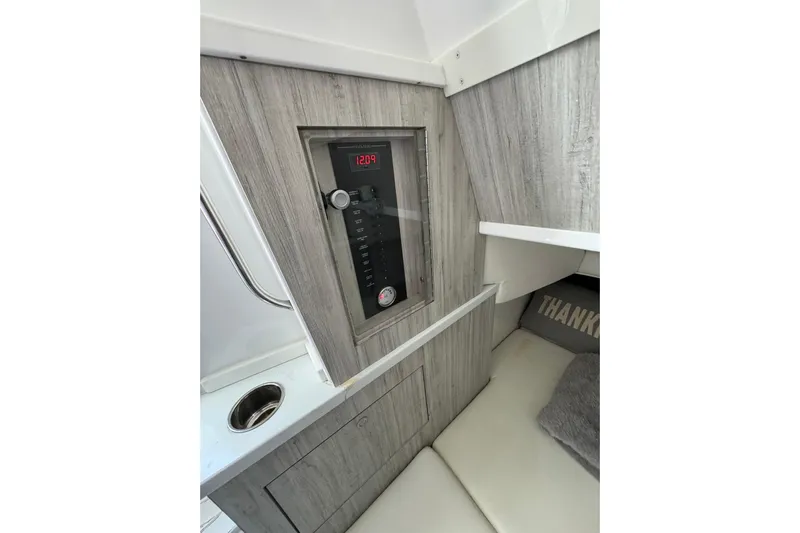  Yacht Photos Pics 2020 HCB 42 Siesta cabin interior with control panel and seating area.