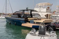 Seanfinity T4 2021 luxury yacht docked in marina, featuring sleek design and spacious deck.