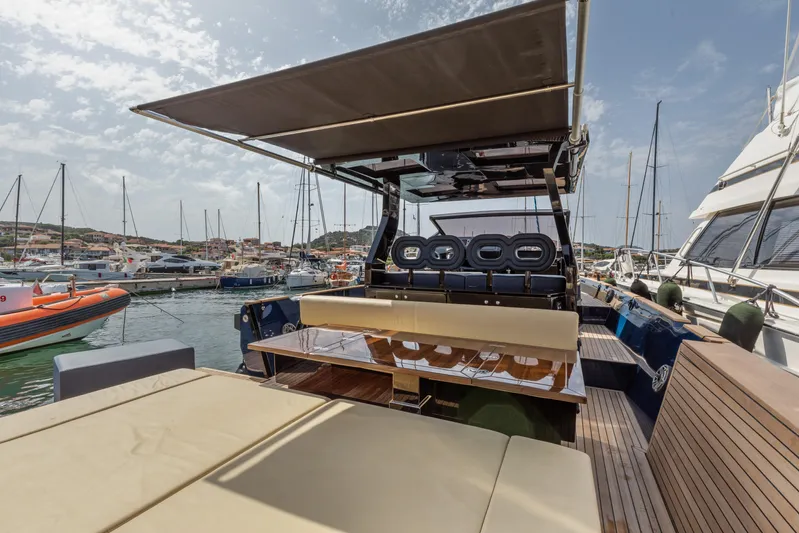  Yacht Photos Pics Seanfinity T4 2021 yacht interior with seating, docked in a marina under a canopy.
