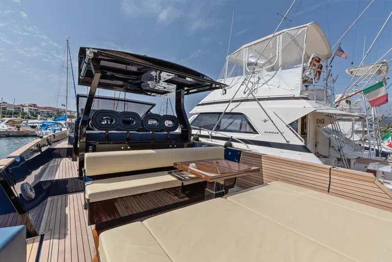  Yacht Photos Pics Luxurious 2021 Seanfinity T4 yacht with spacious deck and seating in a marina setting.
