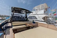 Luxurious 2021 Seanfinity T4 yacht with spacious deck and seating in a marina setting.
