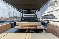 Luxurious 2021 Seanfinity T4 yacht interior with sleek seating and polished wood table.