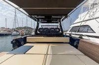 Luxurious 2021 Seanfinity T4 yacht interior with spacious seating at a marina.