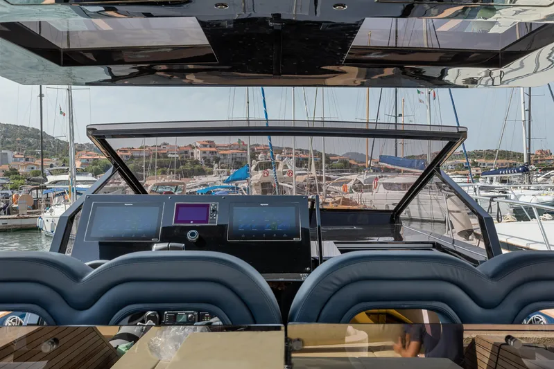  Yacht Photos Pics Cockpit view of 2021 Seanfinity T4 yacht with marina background.