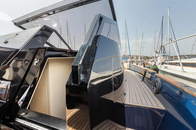  Yacht Photos Pics Seanfinity T4 2021 yacht with sleek design and wooden deck at marina.