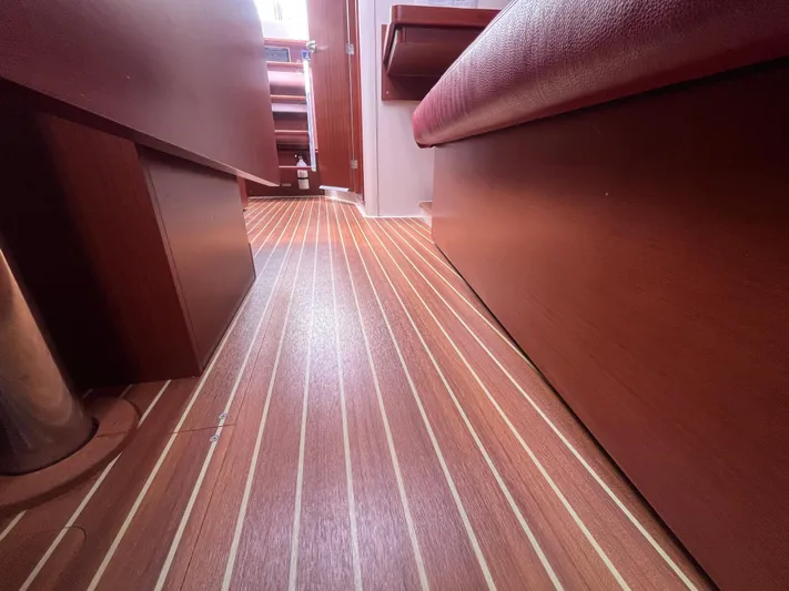 Obatanga Yacht Photos Pics Interior view of 2014 Hanse 345 yacht with wooden flooring and seating.