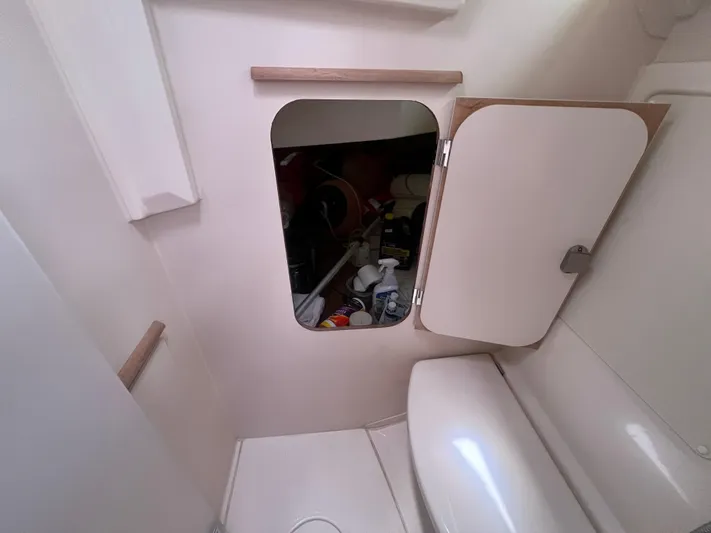 Obatanga Yacht Photos Pics Interior of 2014 Hanse 345 yacht showing storage compartment and seating area.