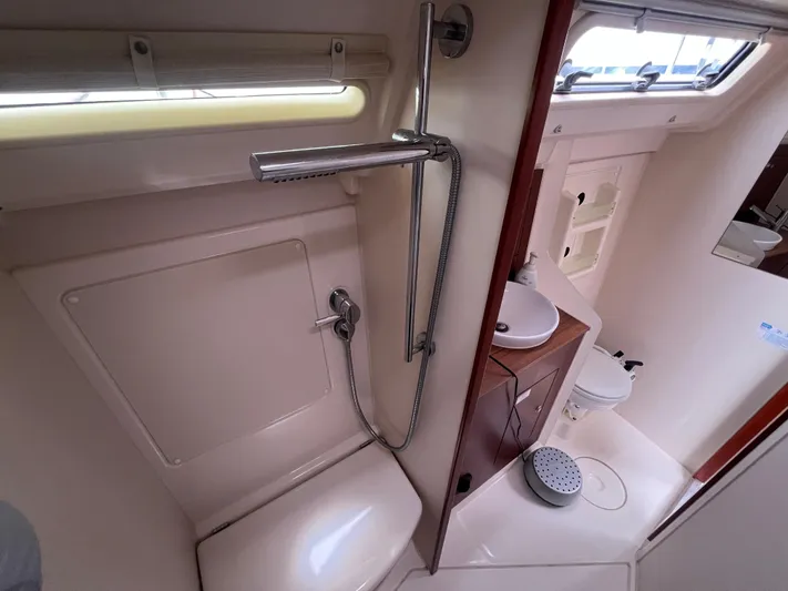 Obatanga Yacht Photos Pics 2014 Hanse 345 yacht bathroom with shower, sink, and toilet.