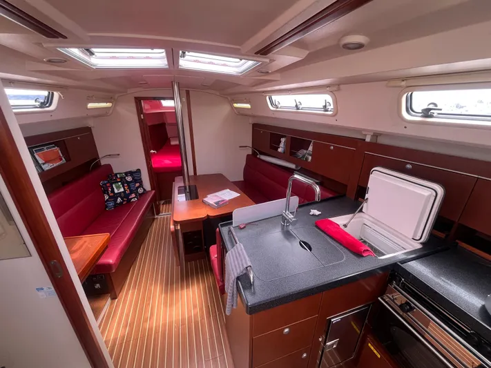 Obatanga Yacht Photos Pics Interior of 2014 Hanse 345 sailboat with modern kitchen and seating area.
