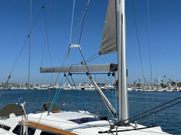 Obatanga Yacht Photos Pics Sailboat Hanse 345, 2014 model, docked in a marina under clear blue skies.
