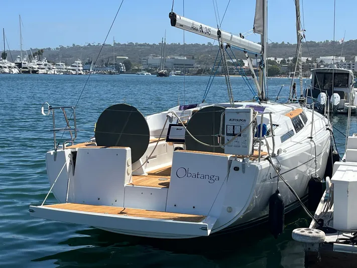 Obatanga Yacht Photos Pics 2014 Hanse 345 sailboat docked in marina, sunny day, calm water.