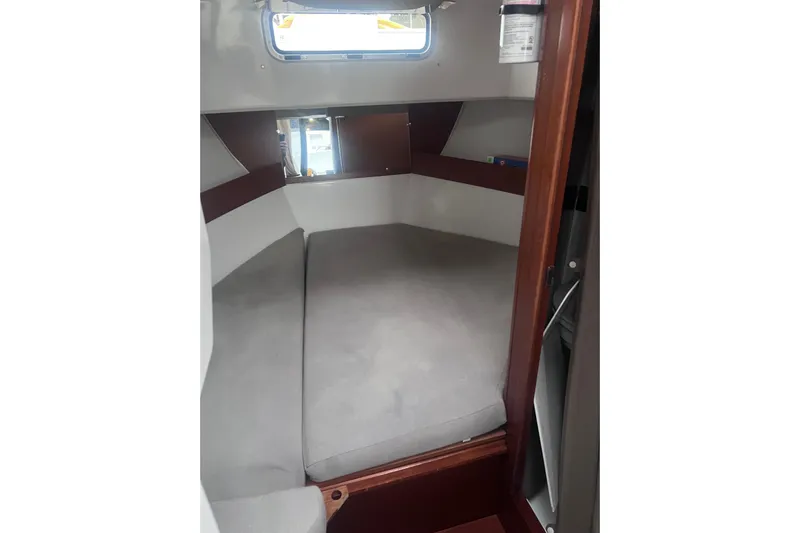  Yacht Photos Pics 2015 Jeanneau Merry Fisher 855 Marlin cabin interior with cushioned seating.