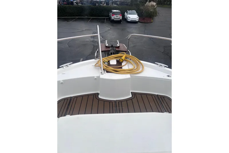  Yacht Photos Pics 2015 Jeanneau Merry Fisher 855 Marlin boat deck with coiled yellow hose.