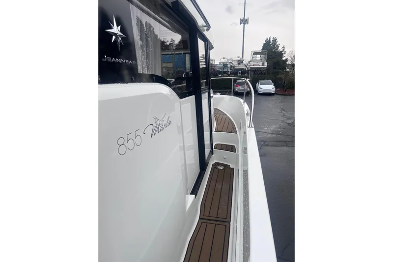  Yacht Photos Pics 2015 Jeanneau Merry Fisher 855 Marlin boat, side view with deck details.