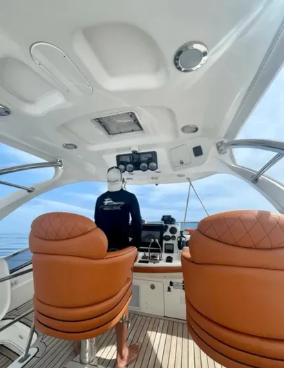  Yacht Photos Pics 2005 Sea Ray Sedan Bridge 520 yacht interior with leather seats and modern controls.