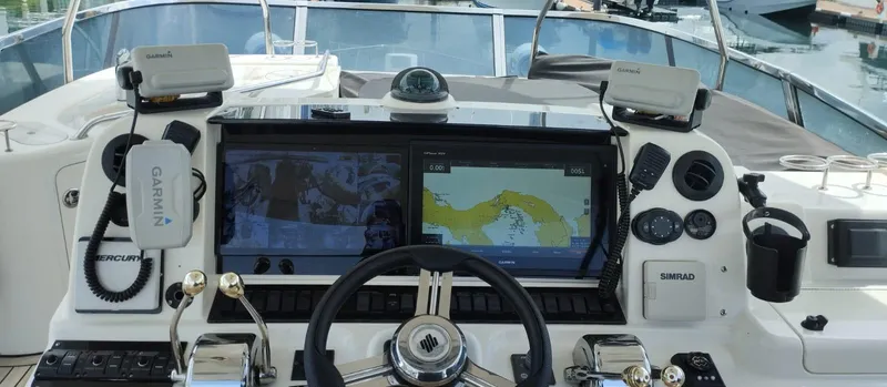  Yacht Photos Pics Helm of 2005 Sea Ray Sedan Bridge 520 with navigation equipment and controls.