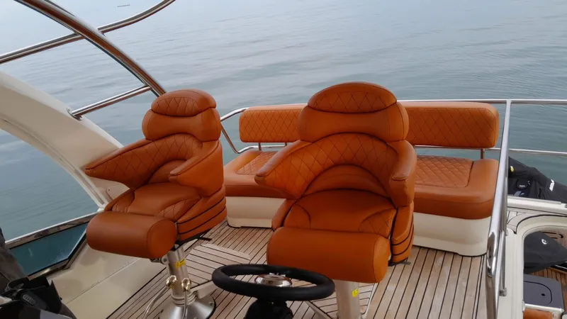  Yacht Photos Pics Luxurious 2005 Sea Ray Sedan Bridge 520 yacht interior with plush seating.