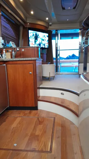  Yacht Photos Pics Luxurious interior of 2005 Sea Ray Sedan Bridge 520 yacht with wooden flooring.