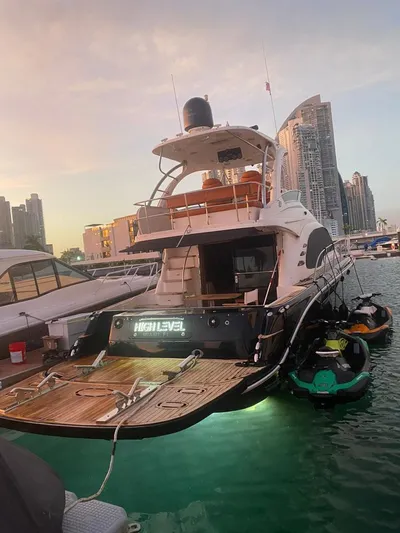  Yacht Photos Pics 2005 Sea Ray Sedan Bridge 520 yacht docked at marina, city skyline in background.