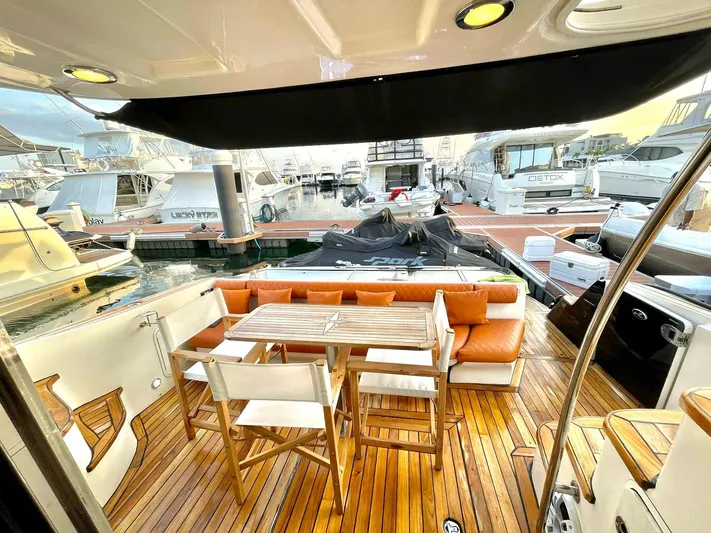  Yacht Photos Pics Luxurious 2005 Sea Ray Sedan Bridge 520 yacht with elegant teak deck and marina view.