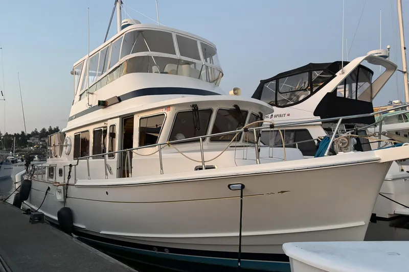 Slainte Yacht Photos Pics 2006 Selene 40 Archer yacht docked at marina, showcasing elegant design and spacious deck.