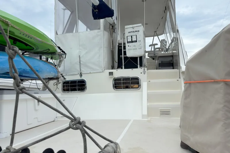 Slainte Yacht Photos Pics 2006 Selene 40 Archer yacht deck with kayaks and covered equipment.