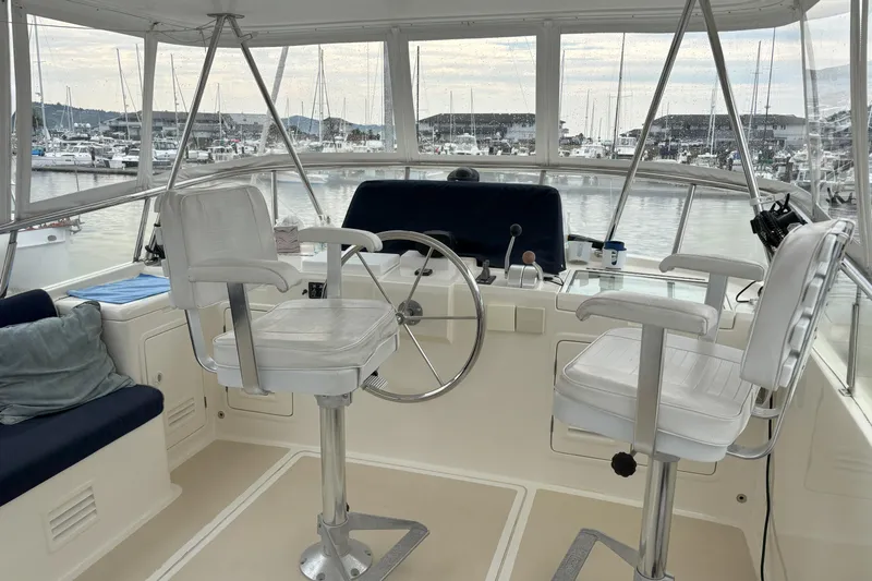 Slainte Yacht Photos Pics Interior view of 2006 Selene 40 Archer yacht helm with marina background.