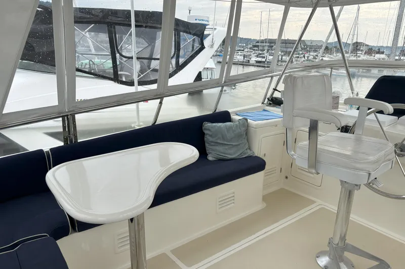 Slainte Yacht Photos Pics Interior of 2006 Selene 40 Archer yacht with seating and helm, docked at marina.
