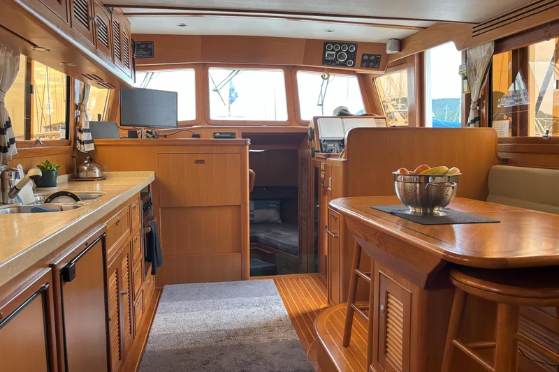 Slainte Yacht Photos Pics Luxurious interior of 2006 Selene 40 Archer yacht with wooden finishes and modern amenities.