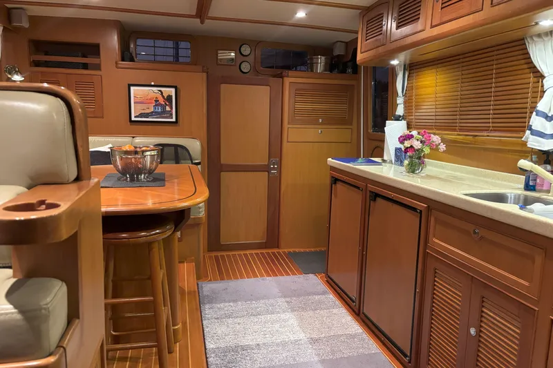 Slainte Yacht Photos Pics Luxurious 2006 Selene 40 Archer yacht interior with wooden cabinetry and modern amenities.