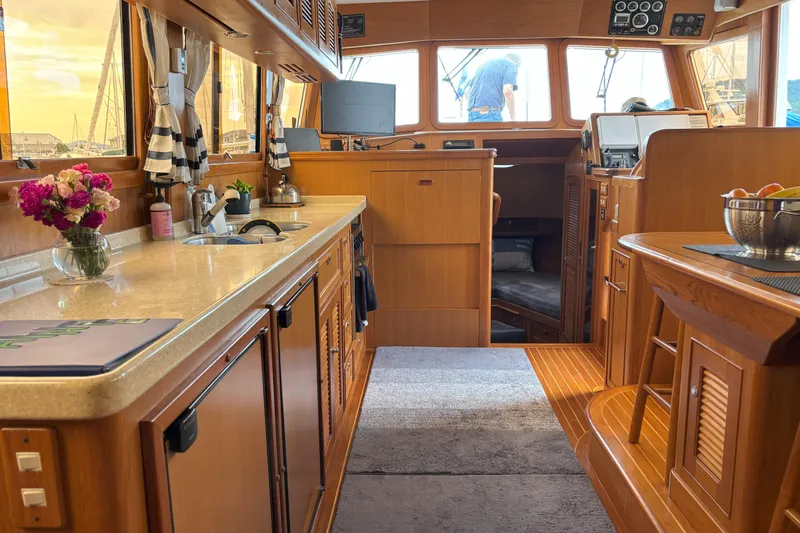 Slainte Yacht Photos Pics Luxurious interior of 2006 Selene 40 Archer yacht with elegant wood finishes and modern amenities.