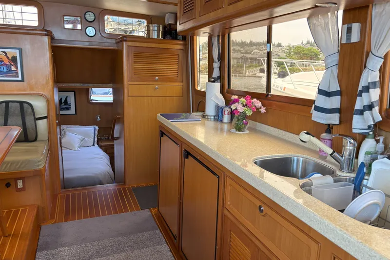 Slainte Yacht Photos Pics Interior of 2006 Selene 40 Archer yacht with cozy kitchen and sleeping area.