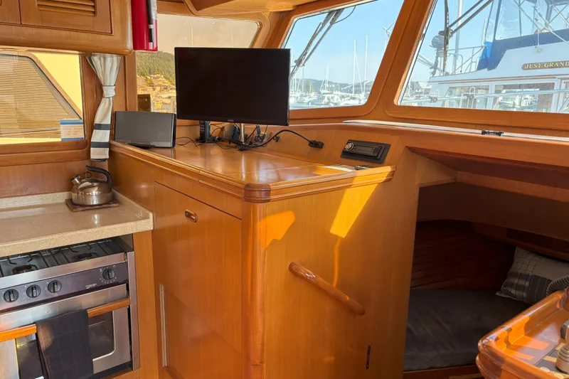 Slainte Yacht Photos Pics Interior of 2006 Selene 40 Archer yacht with kitchen and navigation area.