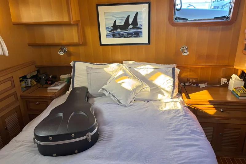 Slainte Yacht Photos Pics Cozy bedroom in 2006 Selene 40 Archer yacht with guitar case and orca artwork.