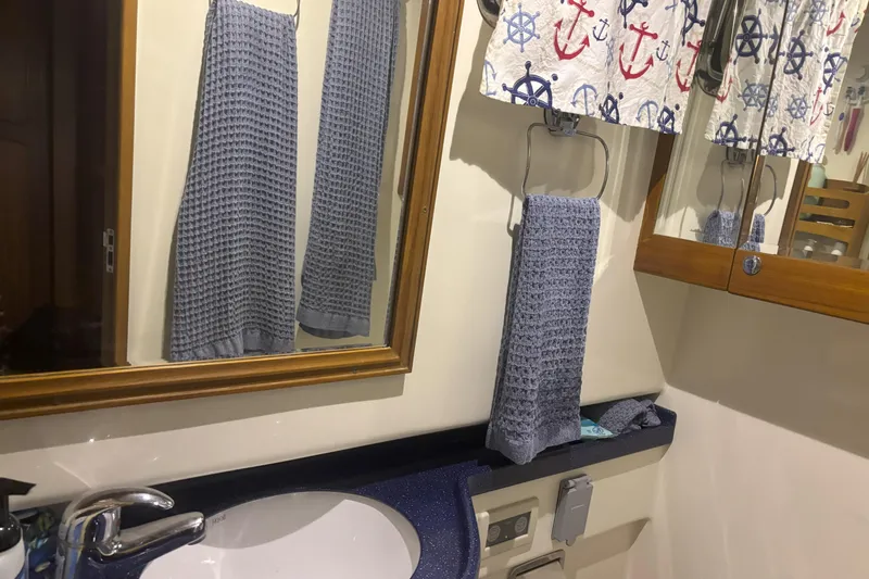 Slainte Yacht Photos Pics Bathroom interior of 2006 Selene 40 Archer yacht with nautical-themed decor.