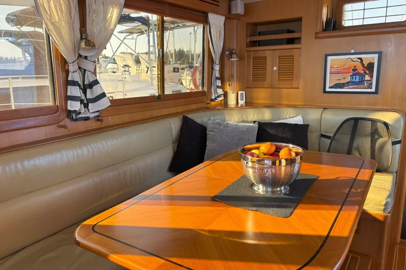 Slainte Yacht Photos Pics Luxurious interior of 2006 Selene 40 Archer yacht with elegant dining area and fruit bowl.
