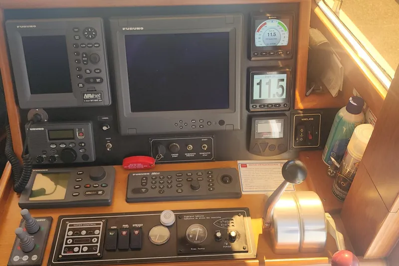 Slainte Yacht Photos Pics Control panel of a 2006 Selene 40 Archer yacht with navigation and communication equipment.