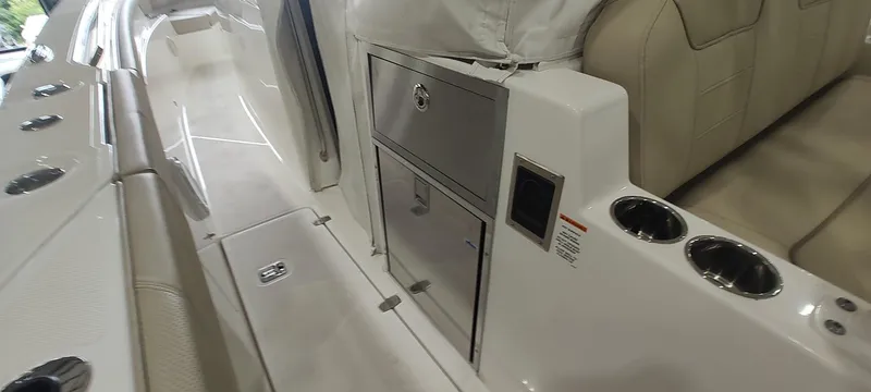  Yacht Photos Pics 2020 Pursuit S 368 Sport boat interior with seating, storage, and cup holders.