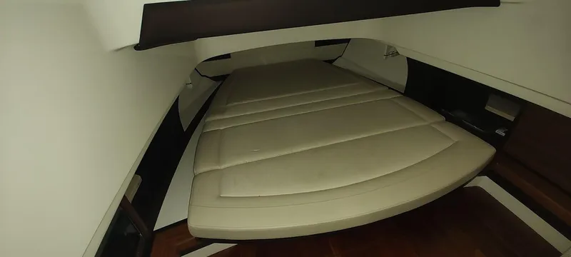  Yacht Photos Pics 2020 Pursuit S 368 Sport cabin interior with beige cushioned seating.