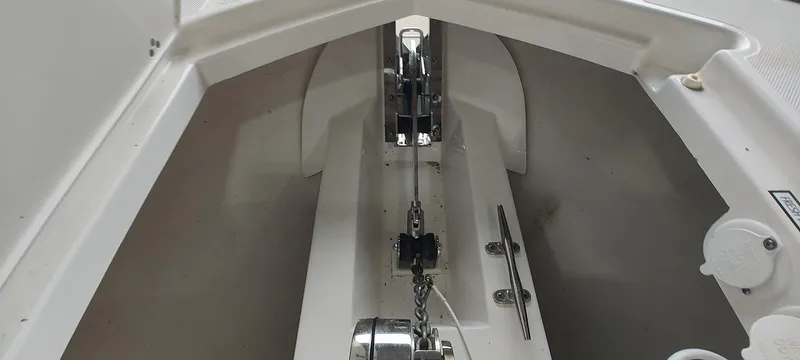  Yacht Photos Pics Anchor compartment of 2020 Pursuit S 368 Sport boat, showcasing chain and winch system.