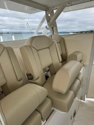 Yacht Photos Pics 2020 Pursuit S 368 Sport boat interior with beige leather seats.