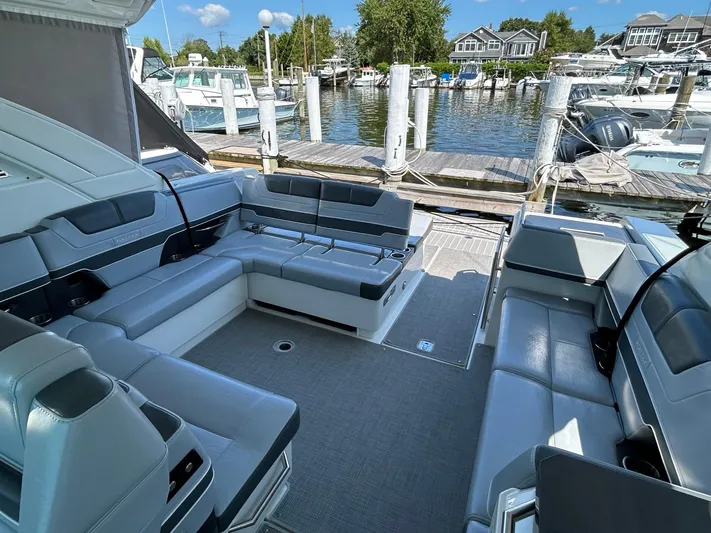  Yacht Photos Pics 2020 Formula 380 Super Sport Crossover boat interior at marina, featuring spacious seating.