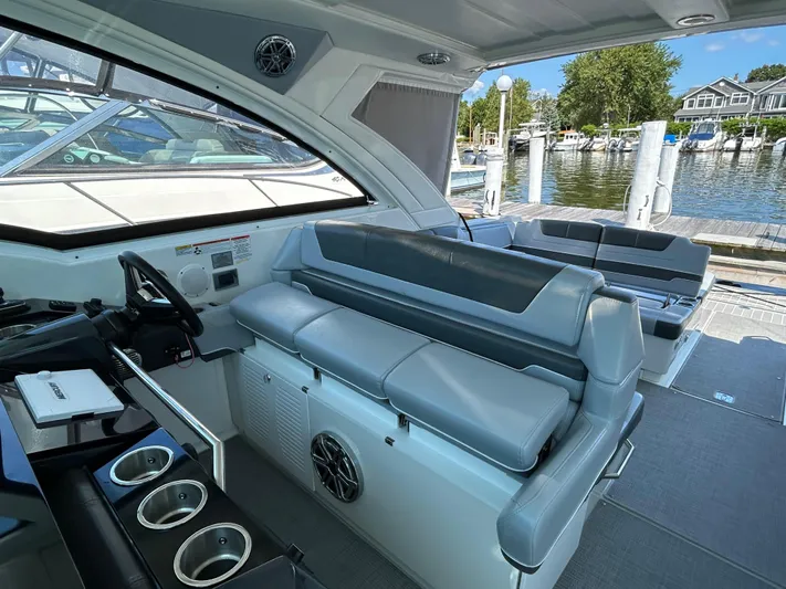  Yacht Photos Pics 2020 Formula 380 Super Sport Crossover interior with sleek seating and modern design at a marina.