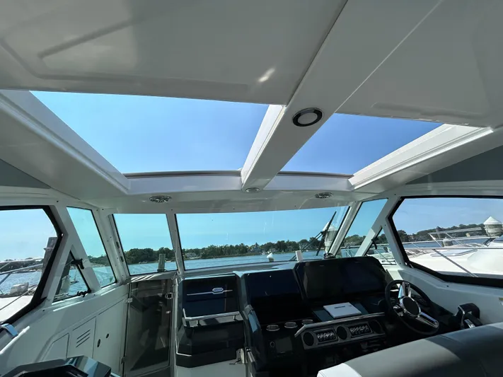  Yacht Photos Pics 2020 Formula 380 Super Sport Crossover cockpit with panoramic windows and modern controls.