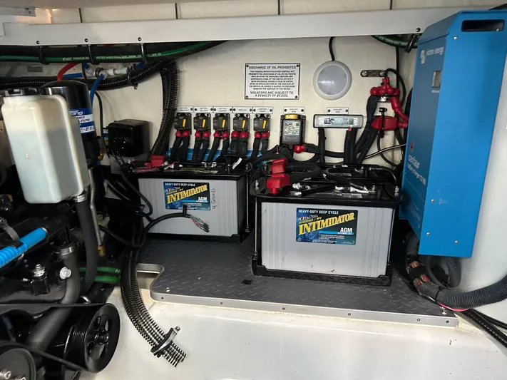  Yacht Photos Pics 2020 Formula 380 Super Sport Crossover engine compartment with batteries and electrical components.